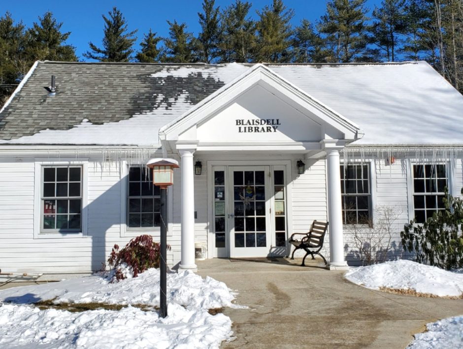 A photo of the Blaisdell Memorial Library building in winter, covered in snow